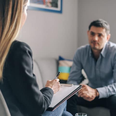 Man meeting with therapist about drug addiction