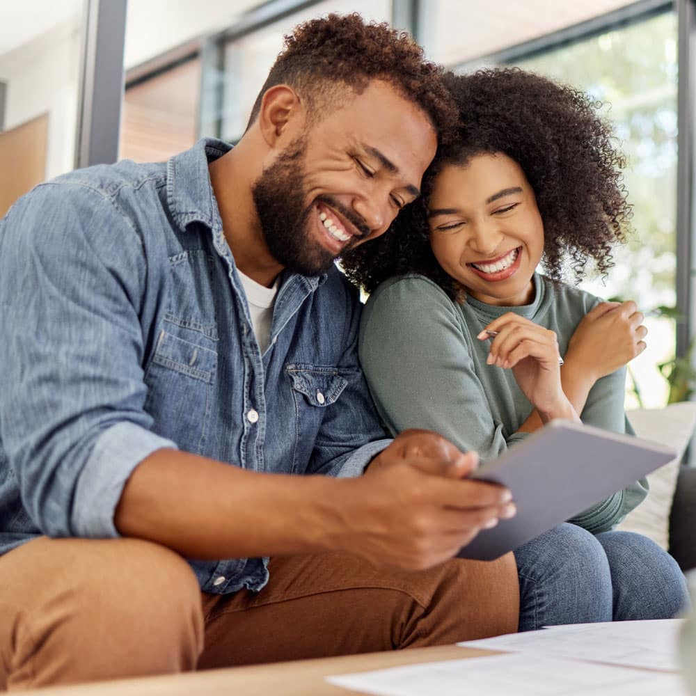 couple happily discussing finances