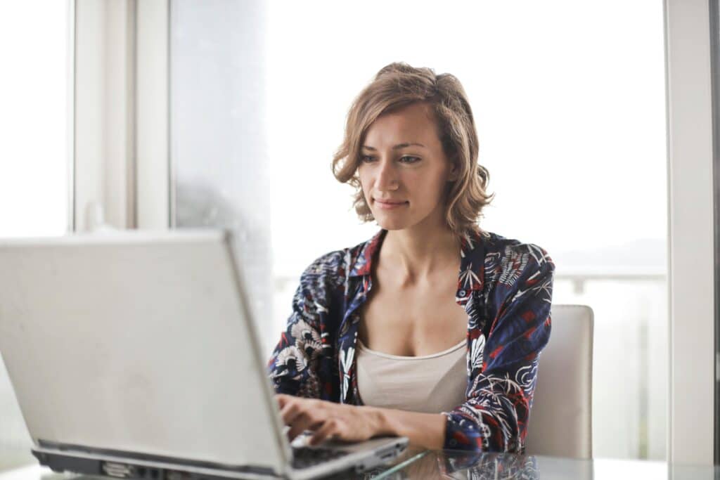Woman doing virtual IOP classes online