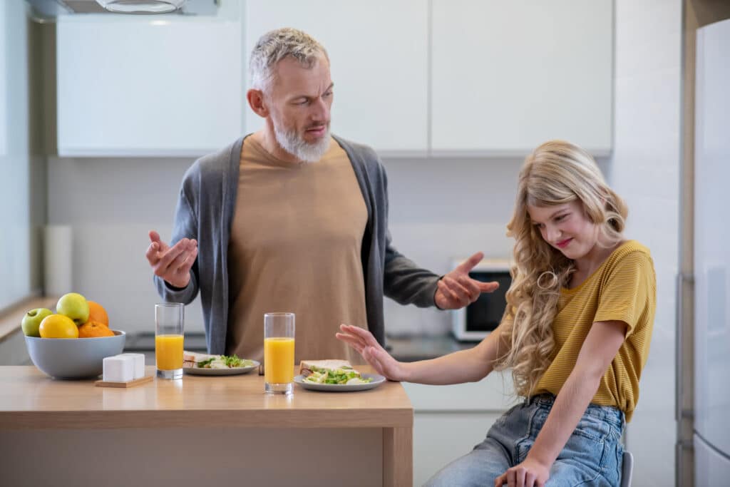 Dad trying to make his daughter eat something new for breakfast but she has an aversion to it due to ARFID eating disorder